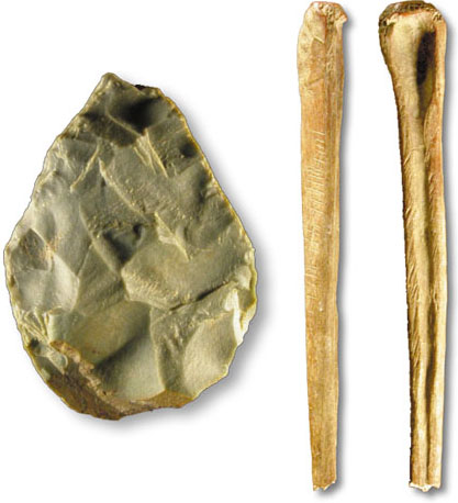 hand axe and shaped wolf bone from the site by the river Yana in North East Siberia dated to 18KYA to 29KYA